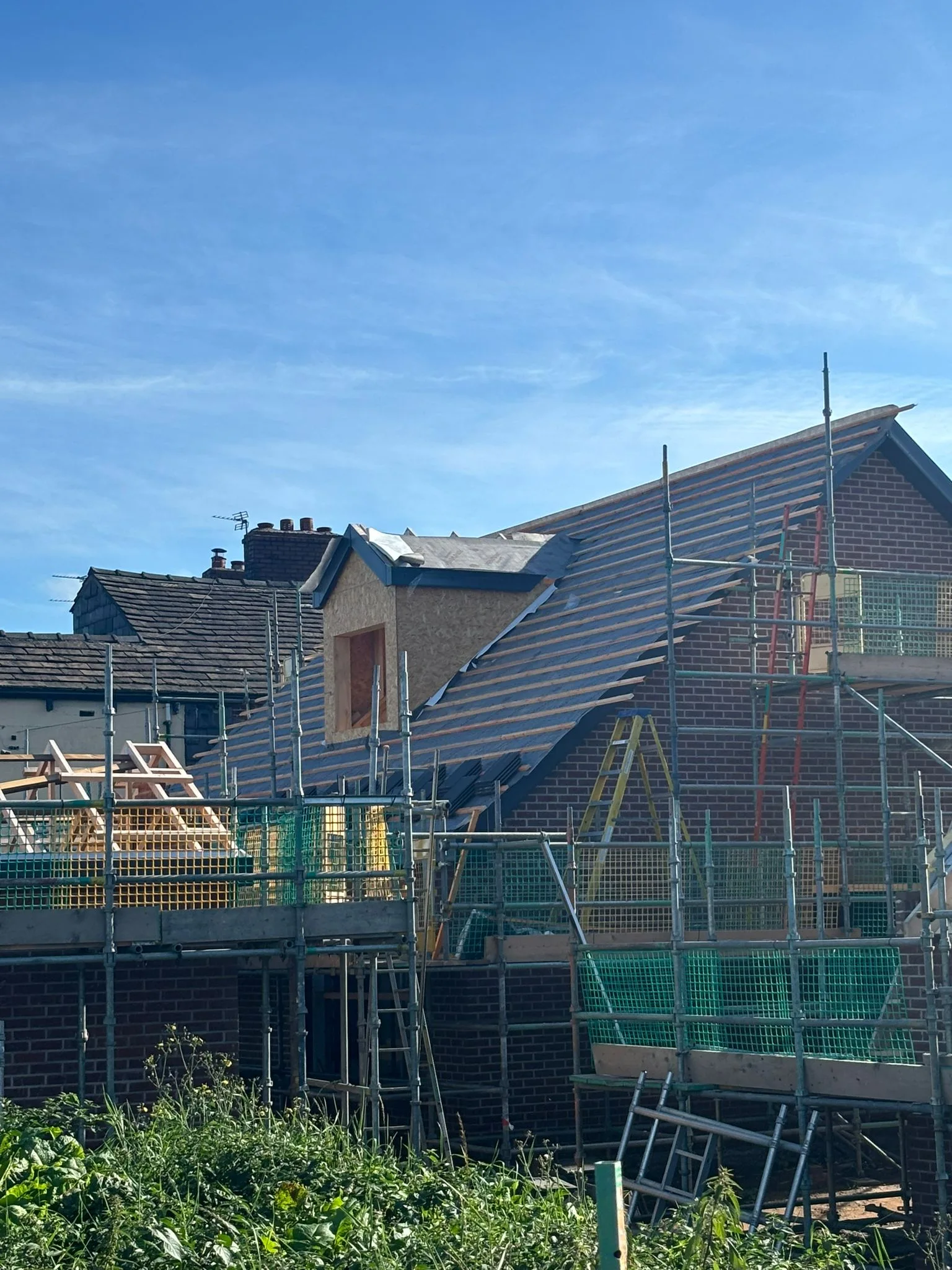 Roofing work with scaffolding
